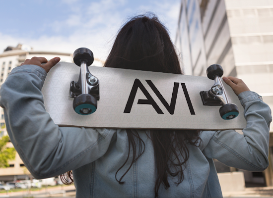 AVI portfolio visual with brand mark applied to a skateboard